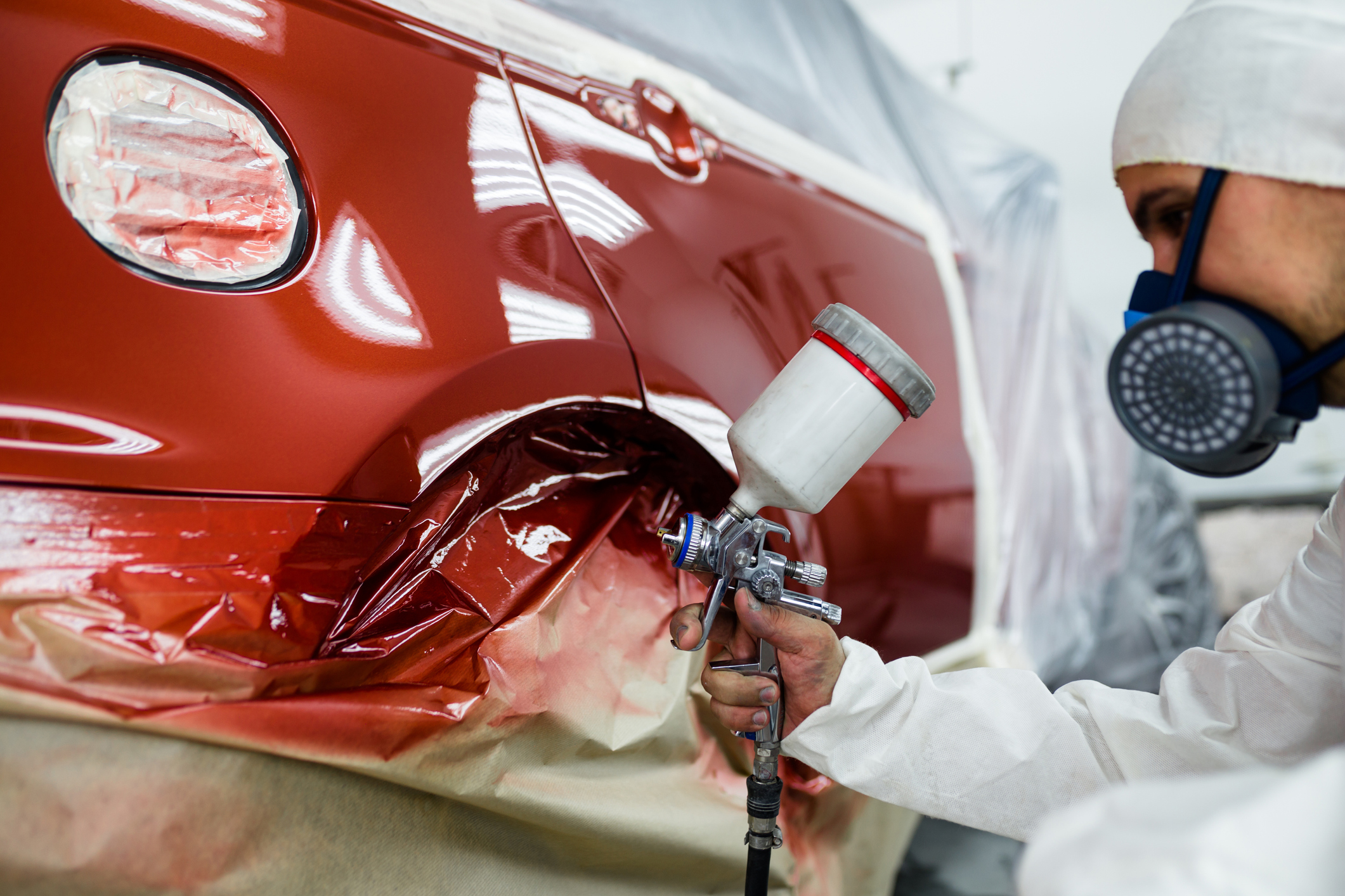 person painting car
