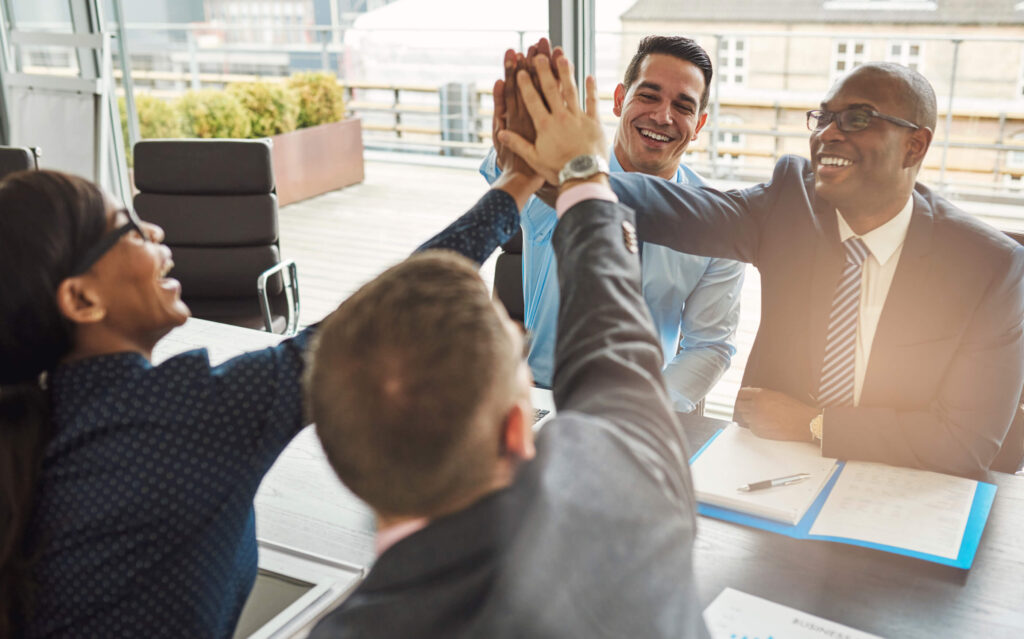 office workers high-fiving