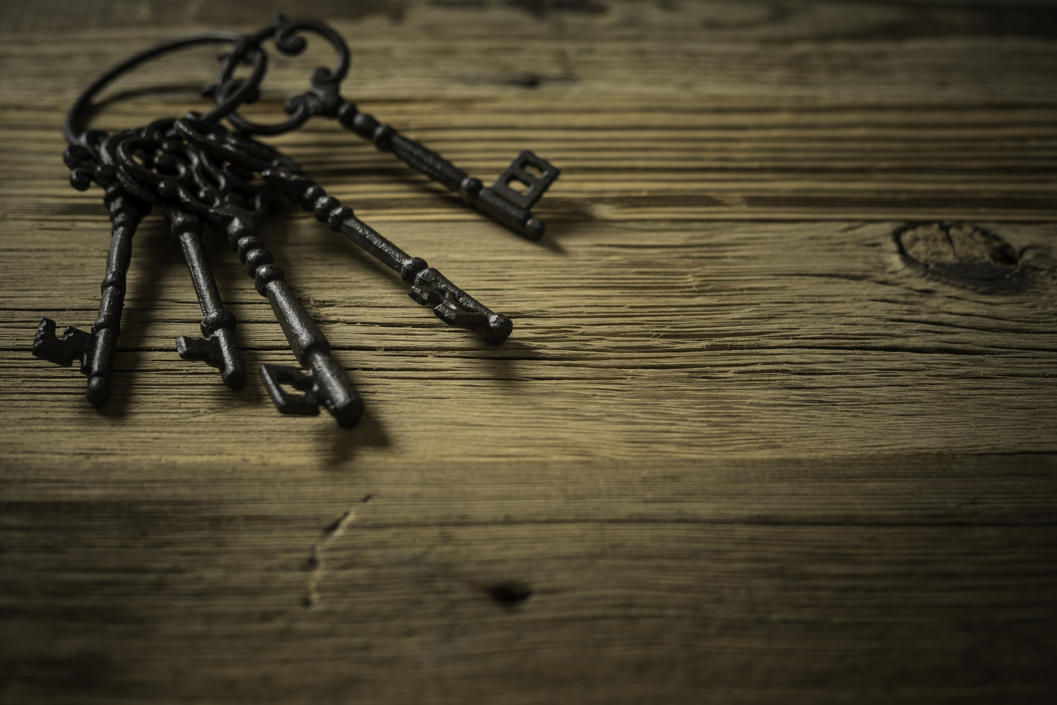 old keys on wooden table