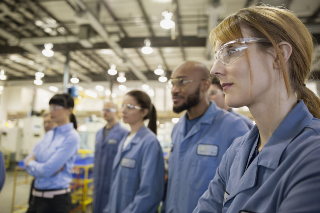 factory workers listening at meeting