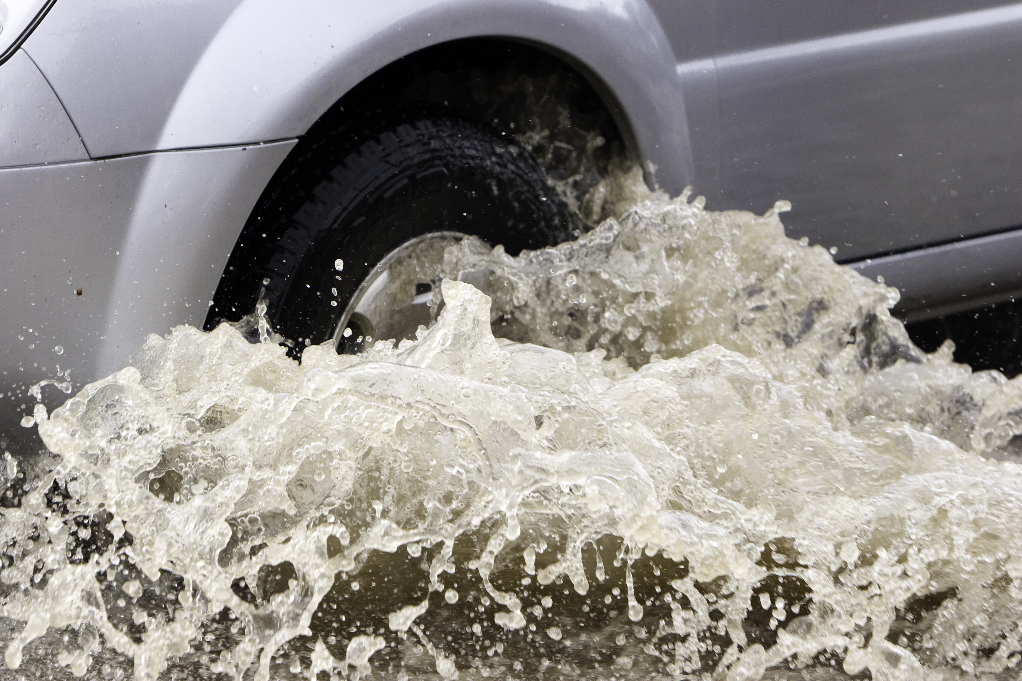 car driving through flood