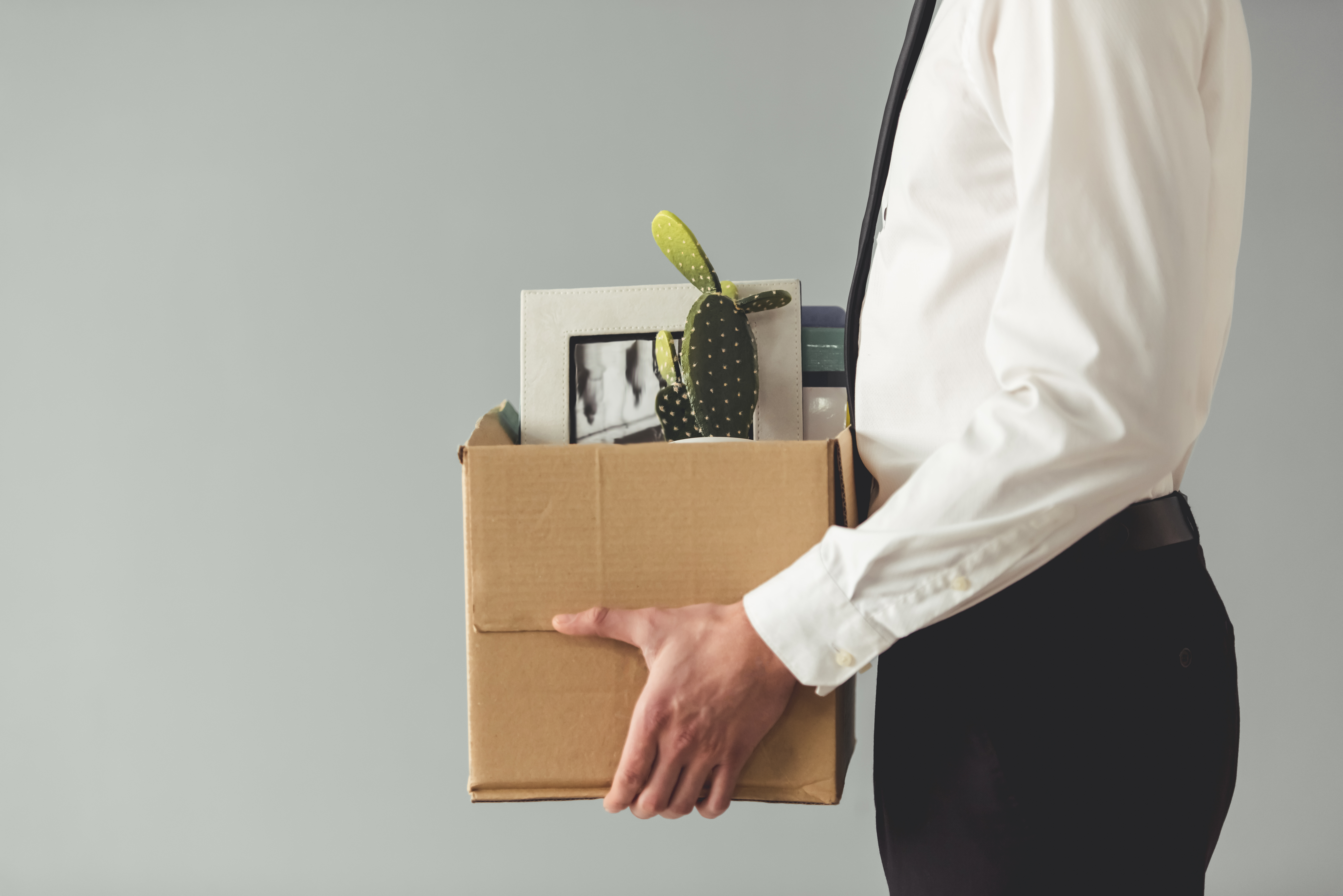 office worker carrying box of things