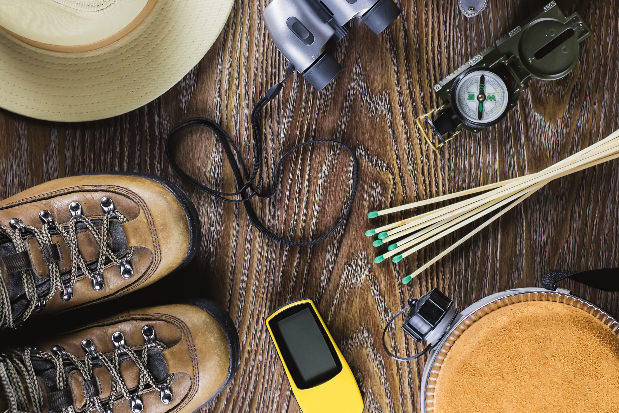 hiking equipment on wood background