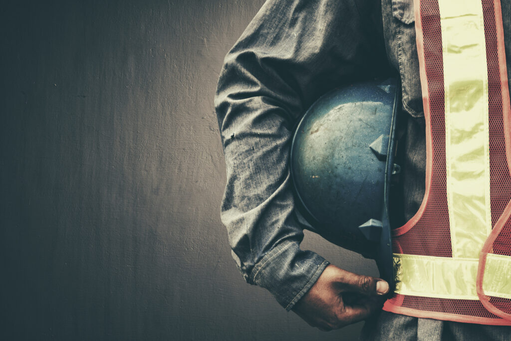 closeup of person holding blue helmet