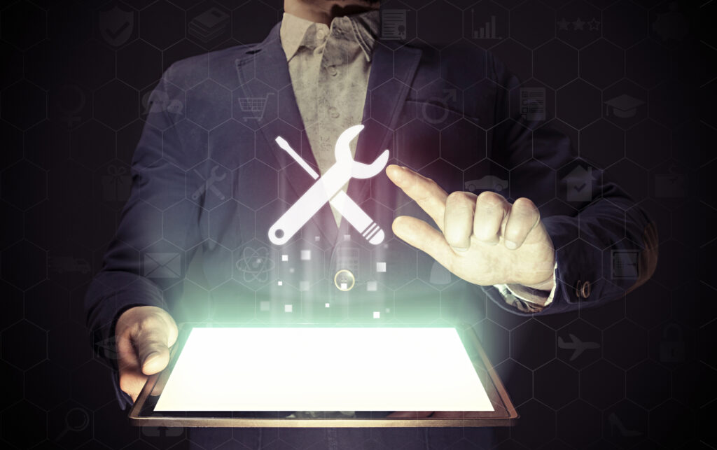 person with tablet and tool icon
