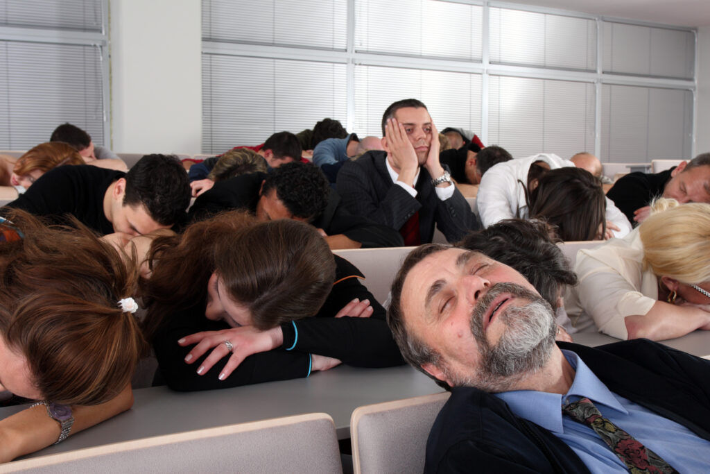 business people sleeping in seminar