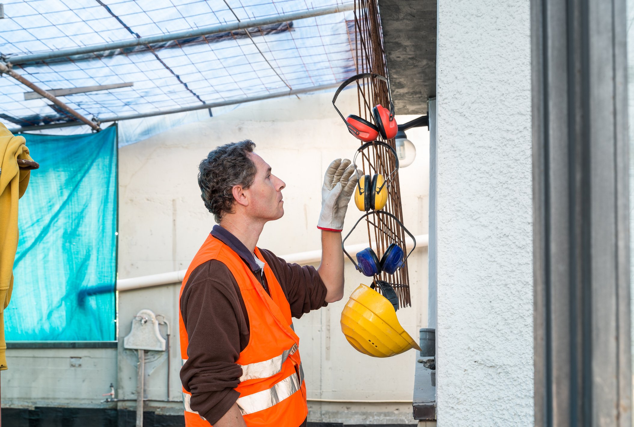 worker choosing protective gear