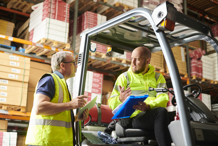 warehouse workers consulting