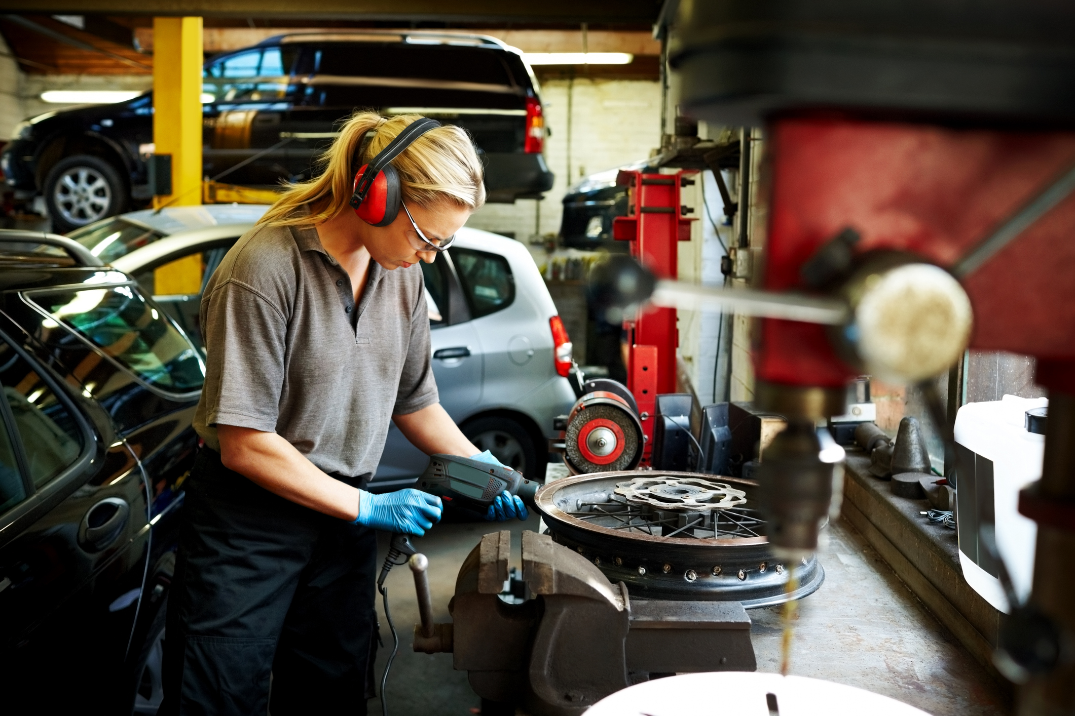 Female mechanic working in auto garage